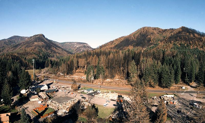 Landscape showing wildfire damage -- Link to article about updated wildfire hazard map 